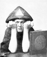 Aleister Crowley wearing the headdress of Horus (1910)